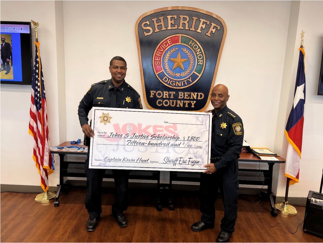 Fort Bend County Sheriff Eric Fagan, right, and Captain Kevin Hunt display a check to “cover” scholarships for 26 graduating high school seniors from Fort Bend County each received a $1,500 scholarship from Sheriff Eric Fagan, Jokes and Justice, in partnership with Patrick’s Project, and Unlimited Visions Aftercare, Inc. In 2014, Fagan and Hunt started “Jokes and Justice,” a comedy showcase for a cause. Since its inception, Jokes and Justice brings the community and law enforcement together to share an evening of laughter. About $136,000 in scholarships has been awarded to graduating high school seniors.
